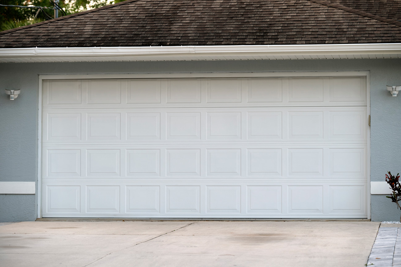 Clean white garage door installed in Hopwood, PA by Bear Door Services